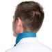 The back of a man wearing a teal Intedge chef neckerchief.
