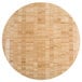 An American Metalcraft bamboo round cutting and serving board on a table.