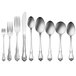 A row of Oneida stainless steel iced tea spoons.
