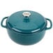 A Lodge Lagoon enameled cast iron Dutch oven in blue with a lid.