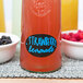 A Franmara neon blue glass marker on a bottle of strawberry lemonade.