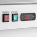 The digital display and switches on an Avantco GDC-49-HC merchandiser refrigerator.