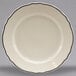 A white Homer Laughlin china plate with black scalloped trim.