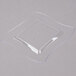 A clear square Fineline plastic plate with curved edges.