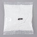 A white plastic bag of Frymaster Filter Magic powder with a small metal clip.