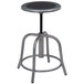 A round metal stool with a black seat and grey base.