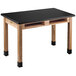 A black National Public Seating science lab table with wooden legs.