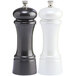 A black and white salt and pepper mill set with black and white caps.