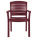 A pack of 4 red Grosfillex Acadia Bordeaux stacking resin armchairs.
