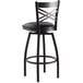 A Lancaster Table & Seating black swivel restaurant bar stool with black vinyl padded seat.