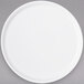 A Carlisle white melamine plate with a round rim.