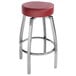 A Lancaster Table & Seating swivel backless bar stool with a maroon vinyl seat and metal legs.