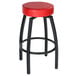 A Lancaster Table & Seating black swivel backless bar stool with a red vinyl seat.