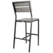 A black aluminum BFM Seating outdoor bar stool with gray synthetic teak back and seat.