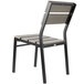 A black BFM Seating outdoor chair with a gray synthetic teak back and seat.