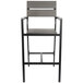 A BFM Seating black aluminum outdoor restaurant bar stool with a gray synthetic teak back and seat.