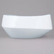 A white porcelain bowl with a blue rim.