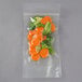 A plastic bag of carrots, broccoli, and vegetables.