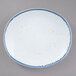 A white rectangular porcelain plate with blue specks.