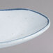 A 10 Strawberry Street Arctic Blue rectangular porcelain plate with blue speckles.