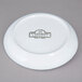 A white 10 Strawberry Street porcelain plate with black text reading "Arctic Blue"