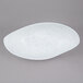 A white porcelain oval shaped bowl with blue speckles.