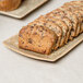 A rectangular porcelain platter with chocolate chip bread on it.