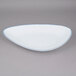 A white porcelain platter with an irregular blue rim.