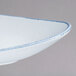A white porcelain platter with blue speckles on it.