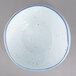A white 10 Strawberry Street porcelain cereal bowl with blue specks.
