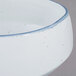 A 10 Strawberry Street Arctic Blue porcelain cereal bowl with blue speckles.