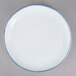 A white porcelain salad plate with a blue speckled rim.