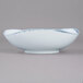 A white bowl with blue specks.
