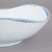 A white porcelain bowl with blue swirls.