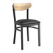 A Lancaster Table & Seating Boomerang Series black wood chair with a black vinyl cushion.