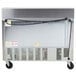 A Beverage-Air stainless steel refrigerated sandwich prep table with 2 open doors on a counter.