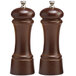 A close-up of a brown Chef Specialties pepper mill with a white cap on a brown glass.