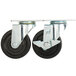 A pair of Avantco metal plate casters with black rubber wheels.