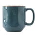 A blue ceramic Tuxton mug with a gold rim and brown specks.