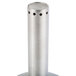 A Franmara stainless steel decanter funnel set on a table stand with a metal cylinder with holes.