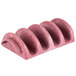 A pink polyethylene taco server with four shell-shaped holders.
