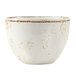 A white bouillon cup with brown speckles on it.