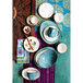 A table set with a stack of white bowls with gold trim and blue and turquoise TuxTrendz China bowls and cups.