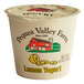 A white Pequea Valley Farm lemon yogurt container with yellow text and a yellow lid.
