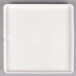 An Arcoroc white porcelain square plate.