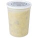 A plastic container of Spring Glen Fresh Foods Chicken Pot Pie Soup with white liquid and yellow potatoes.