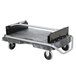 A black and grey Rubbermaid ProServe ice tote cart with wheels and a grey tray.