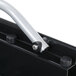 A close-up of a black Rubbermaid Ice Tote Cart handle with metal bolts.