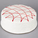 A Pellman white cake with red lines on top.