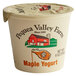 A white Pequea Valley Farm container of maple yogurt with a lid.